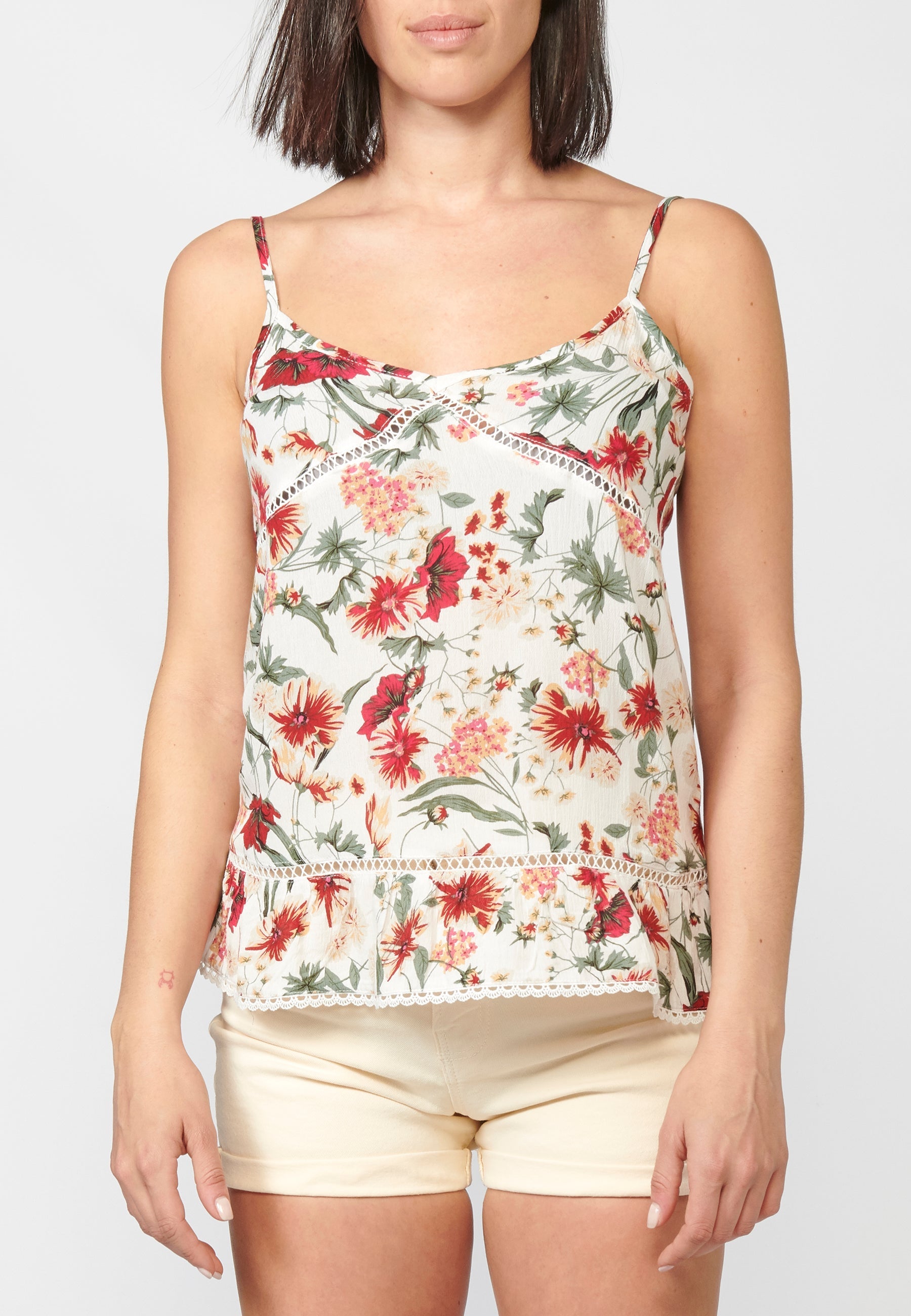 Blusa fluida sin mangas acabado en volante y puntilla | estilo y comodidad