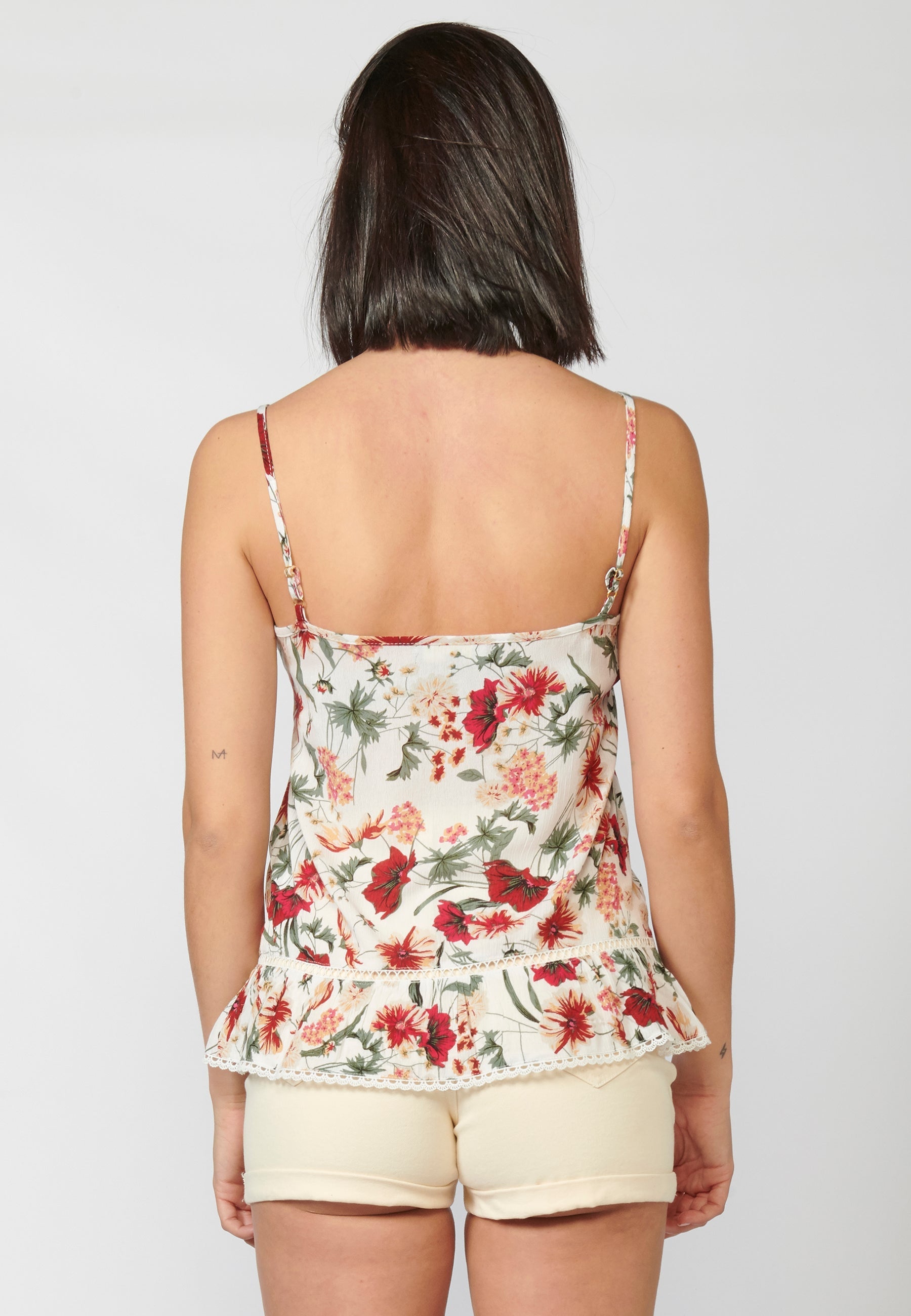Blusa fluida sin mangas acabado en volante y puntilla | estilo y comodidad