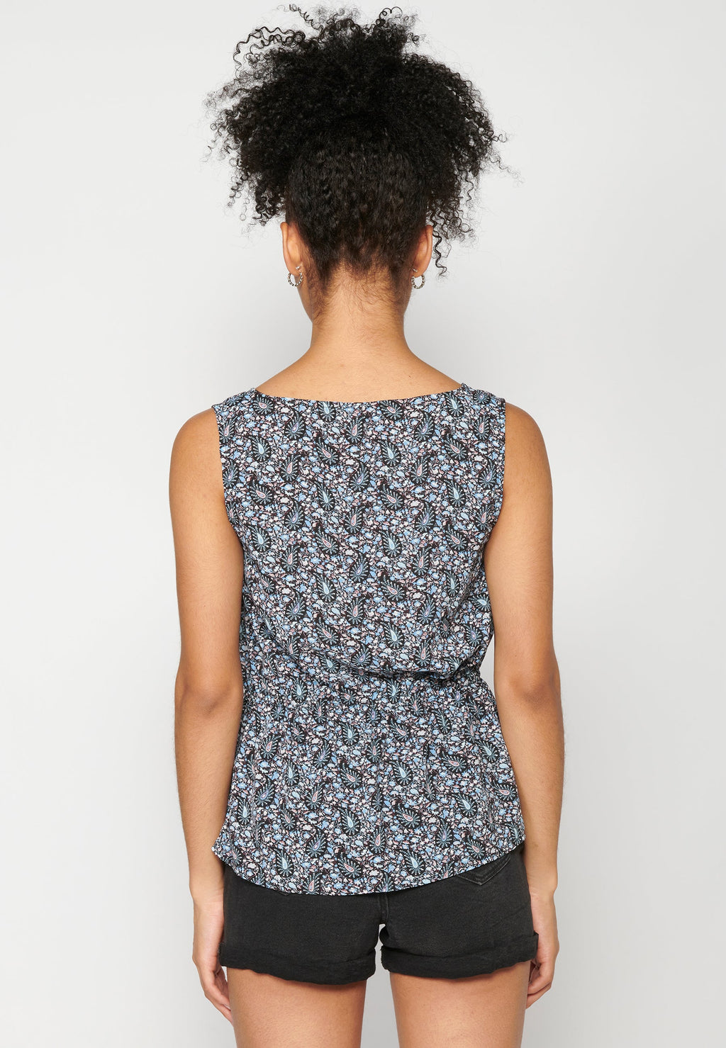 Blusa sin mangas fluida escote de pico para mujer | moda actual