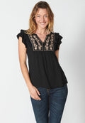 Blusa fluida sin mangas con detalle floral para mujer | moda actual