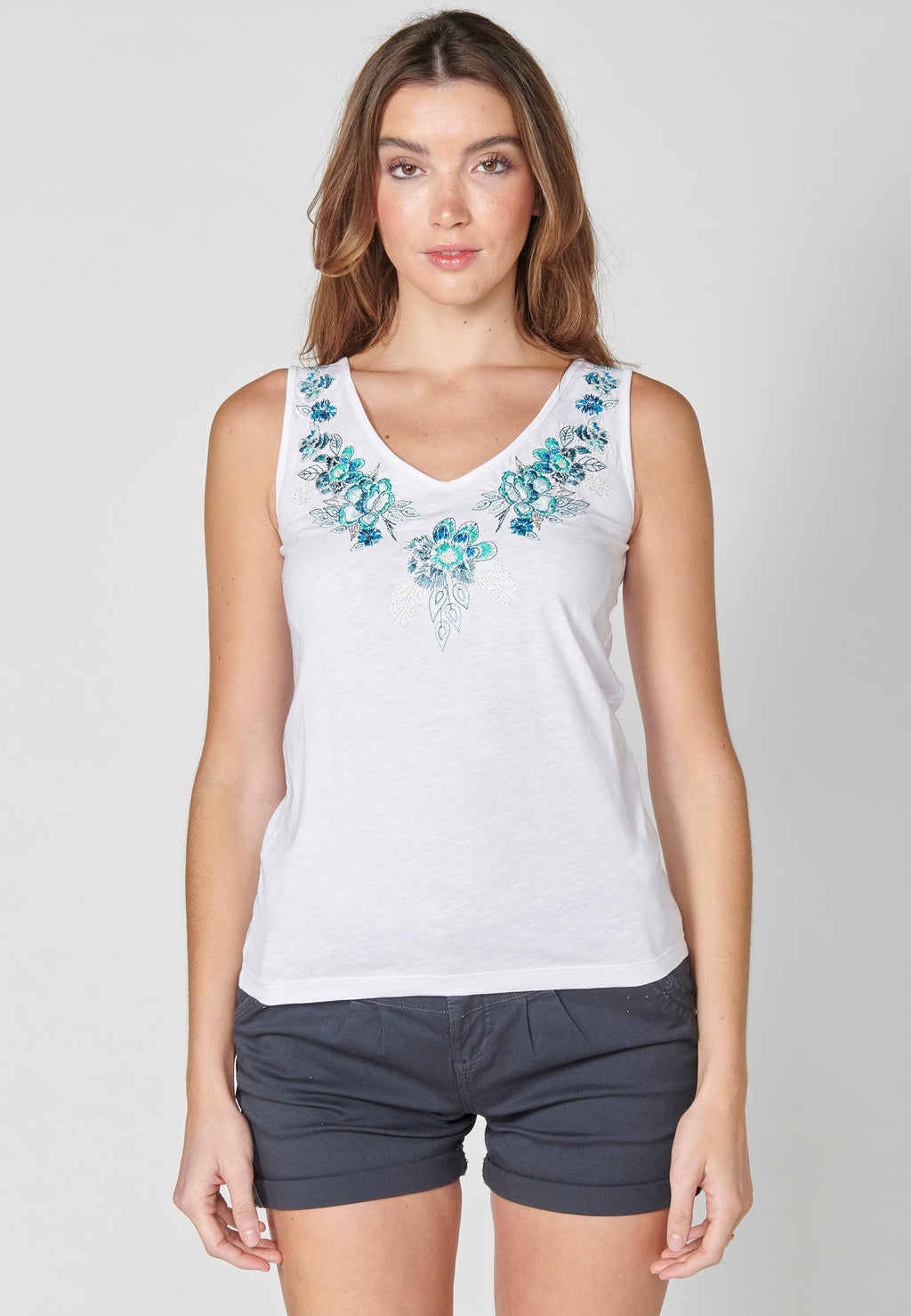 Top sin mangas de algodón con detalle floral para mujer | moda actual