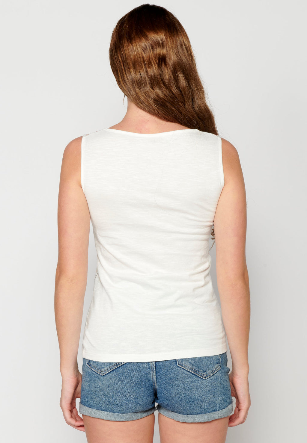 Camiseta top sin mangas con detalles bordados de algodón para mujer | moda actual