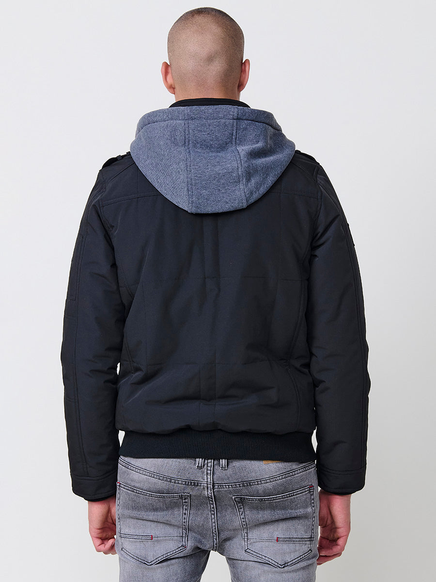 Chaqueta cazadora acolchada hombre con capucha, bolsillos y cierre cremallera.