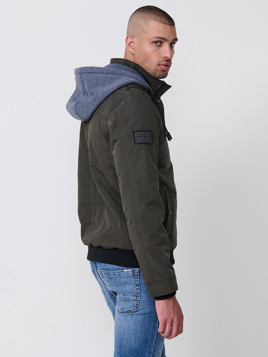 Chaqueta cazadora acolchada hombre con capucha, bolsillos y cierre cremallera.