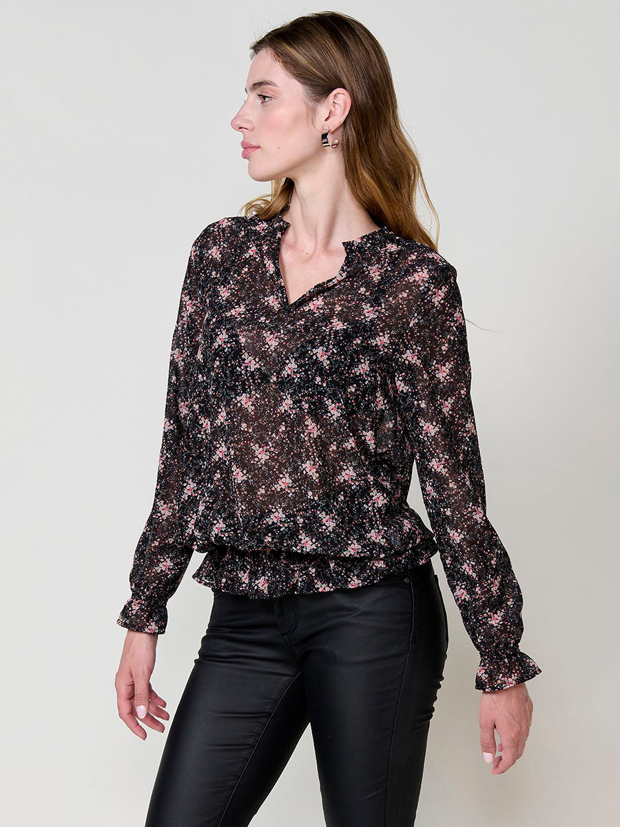 Blusa manga larga mujer semitransparente estampado floral , escote pico y puños engomados.