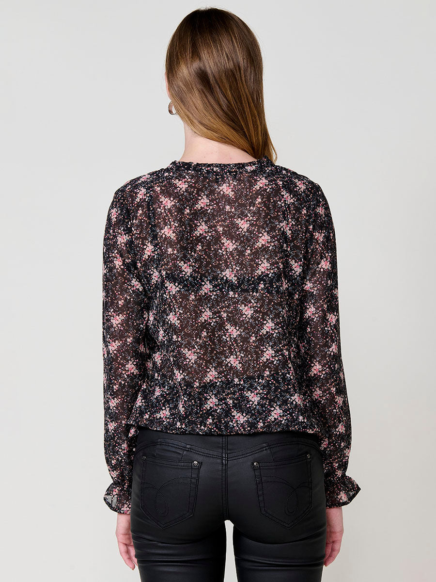 Blusa manga larga mujer semitransparente estampado floral , escote pico y puños engomados.