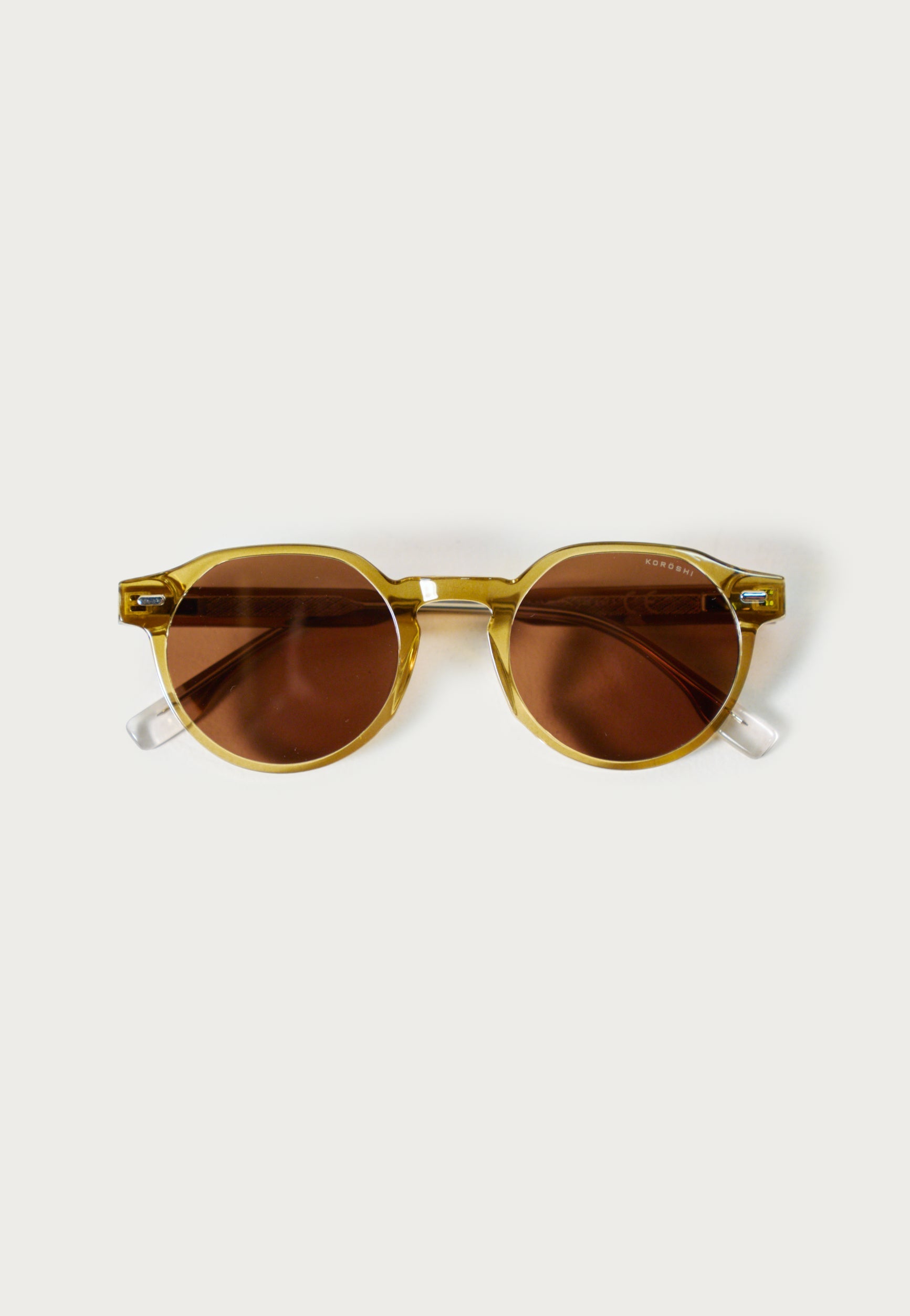 Gafas de Sol Unisex Ovaladas Bronce Lentes Degradadas Montura Transparente Prot. UV – KOROSHI