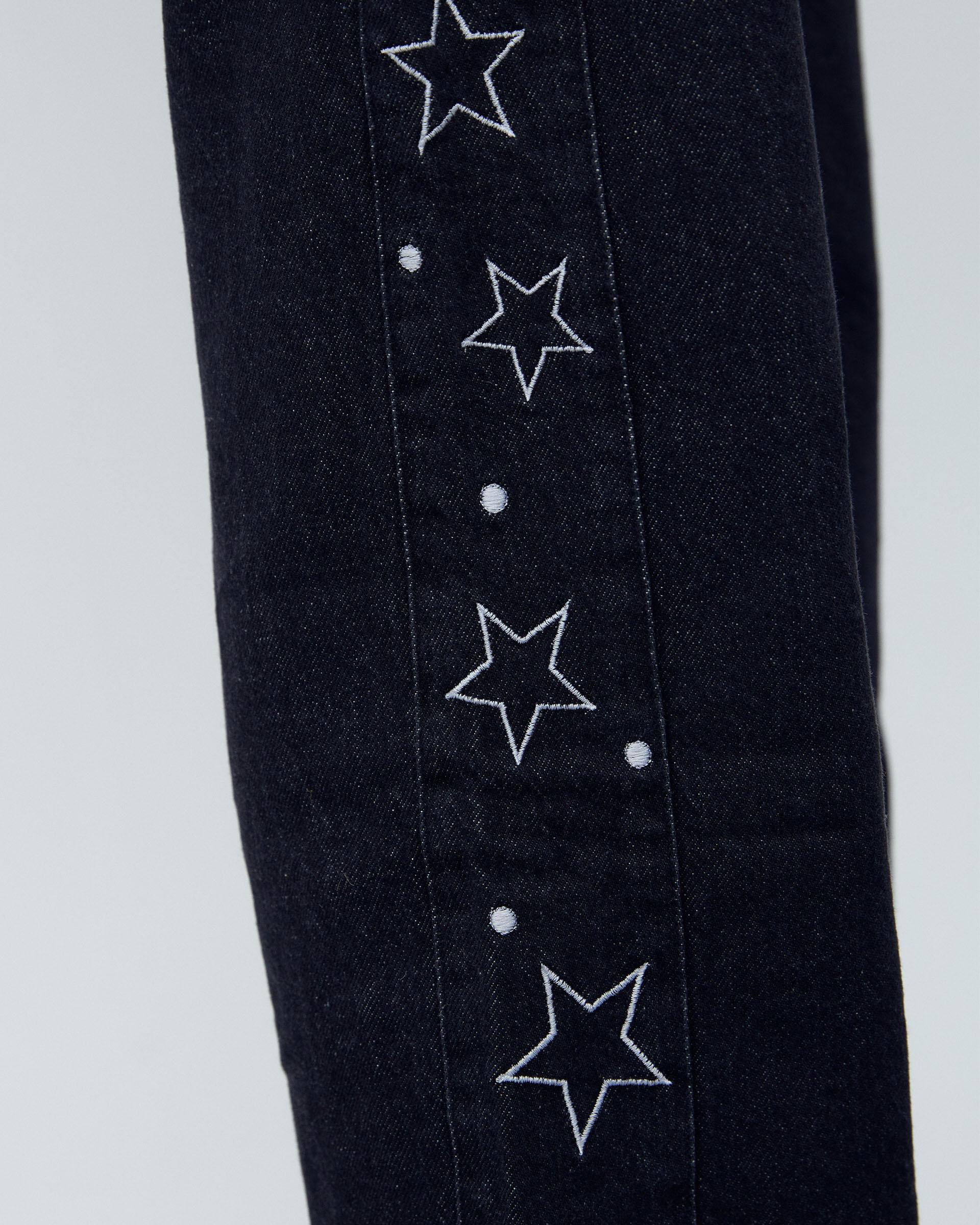 Jeans Pieza Lateral Estrellas Negro