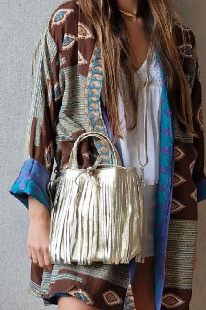 Bolso de piel liso con flecos dorado