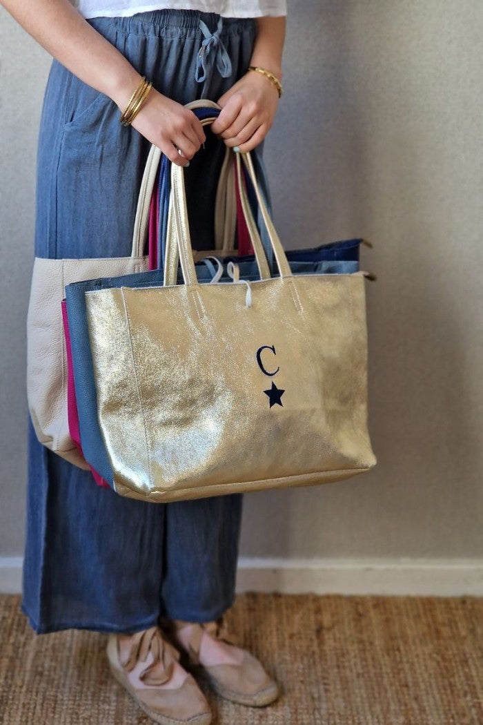 Bolso shopping con cremallera dorado