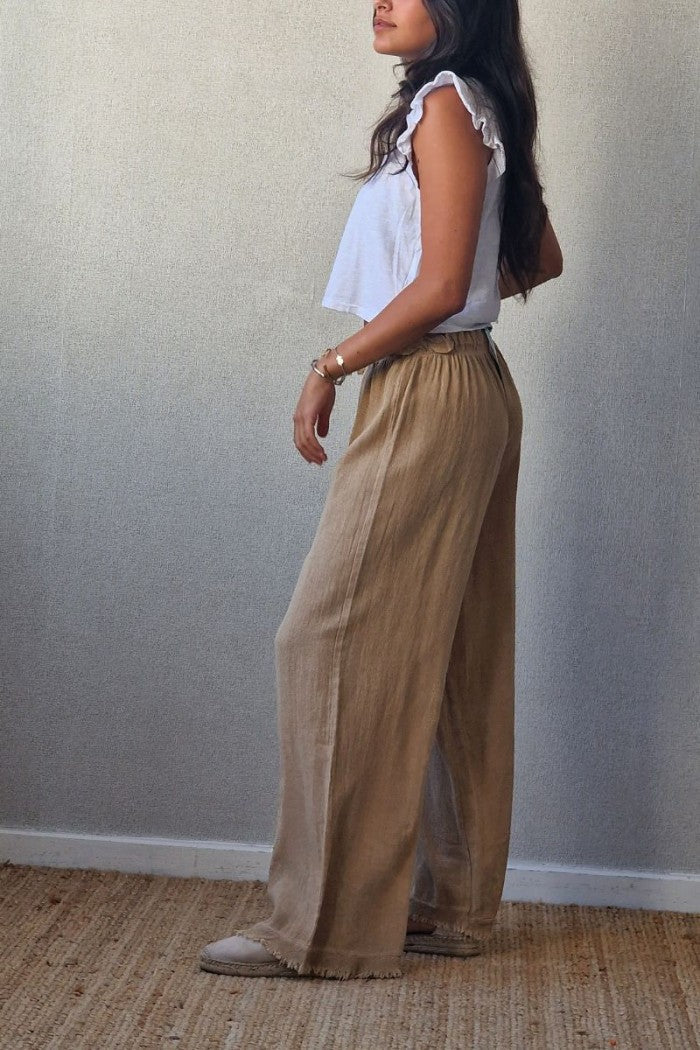 Pantalón tipo lino flecos camel