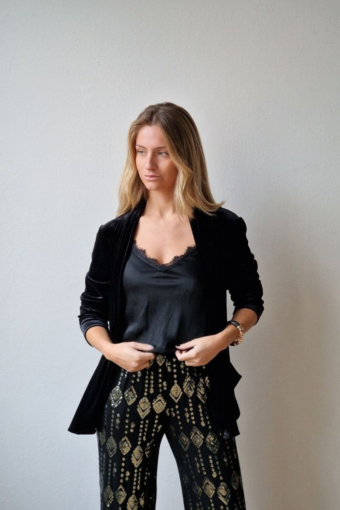 Pantalón de punto negro con lentejuelas