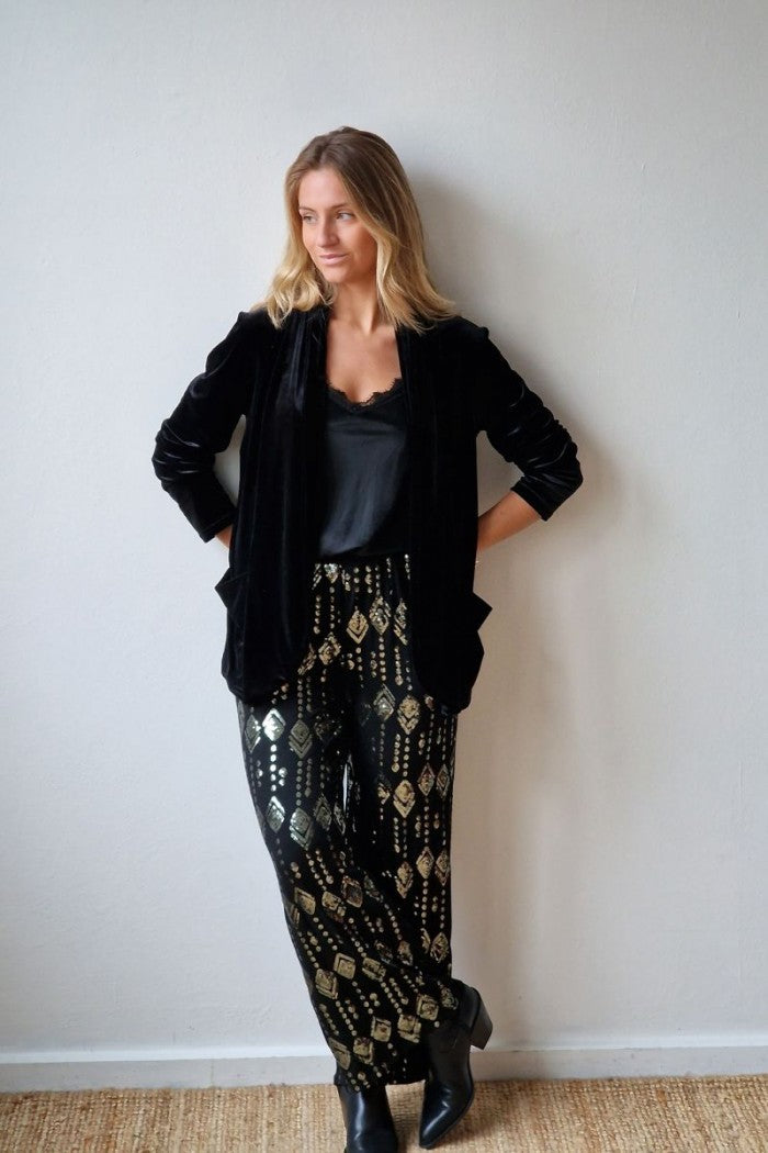 Pantalón de punto negro con lentejuelas