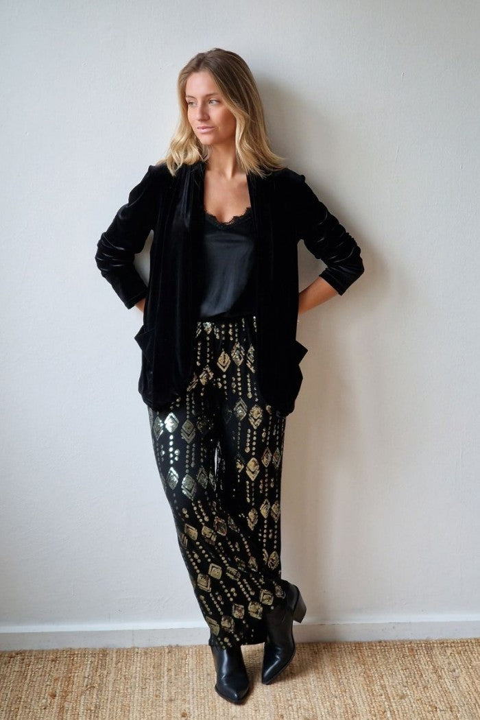 Pantalón de punto negro con lentejuelas
